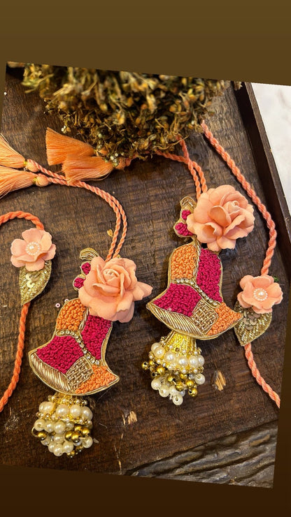 N-02 Pretty Peach Hand-Embroidered Rakhi Set – Elegant Bhai & Bhabhi Pair