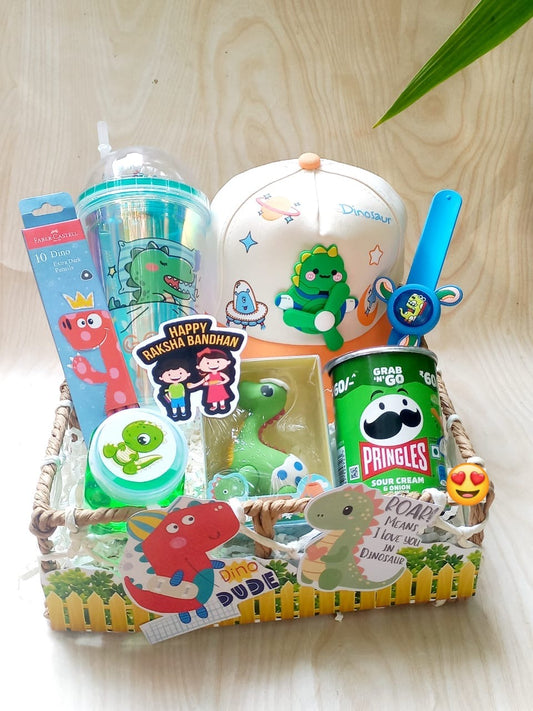 Dinosaur Rakhi Hamper for Kids – Dino Cap, Sipper, Pringles, Stationery & Spinner Rakhi in Decorated Basket