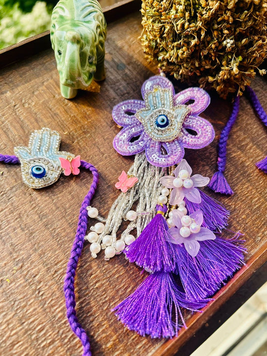 N-36 🧿 Purple Hamsa Evil Eye Bhai Bhabhi Rakhi Lumba Set – Spiritual Rakhi 2025