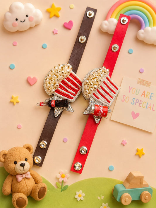 Two decorative wristbands laid flat on a pastel background, one dark brown and one red, each with a rhinestone-covered boot-shaped charm and a small bow. The scene includes a teddy bear, rainbow, clouds, stars, and a note that say 'YOU ARE SO SPECIAL'.