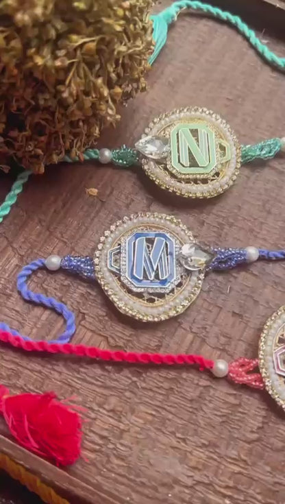 N-25 ✨ Super Stylish Initial Metal Alphabet Rakhi – Silver & Gold Polish for Bhai